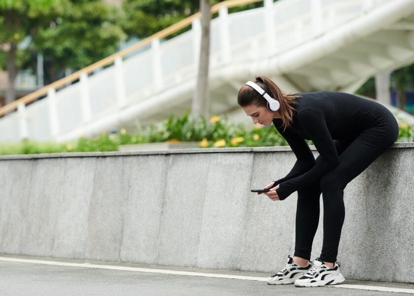 Girl tracking her workouts on her phone